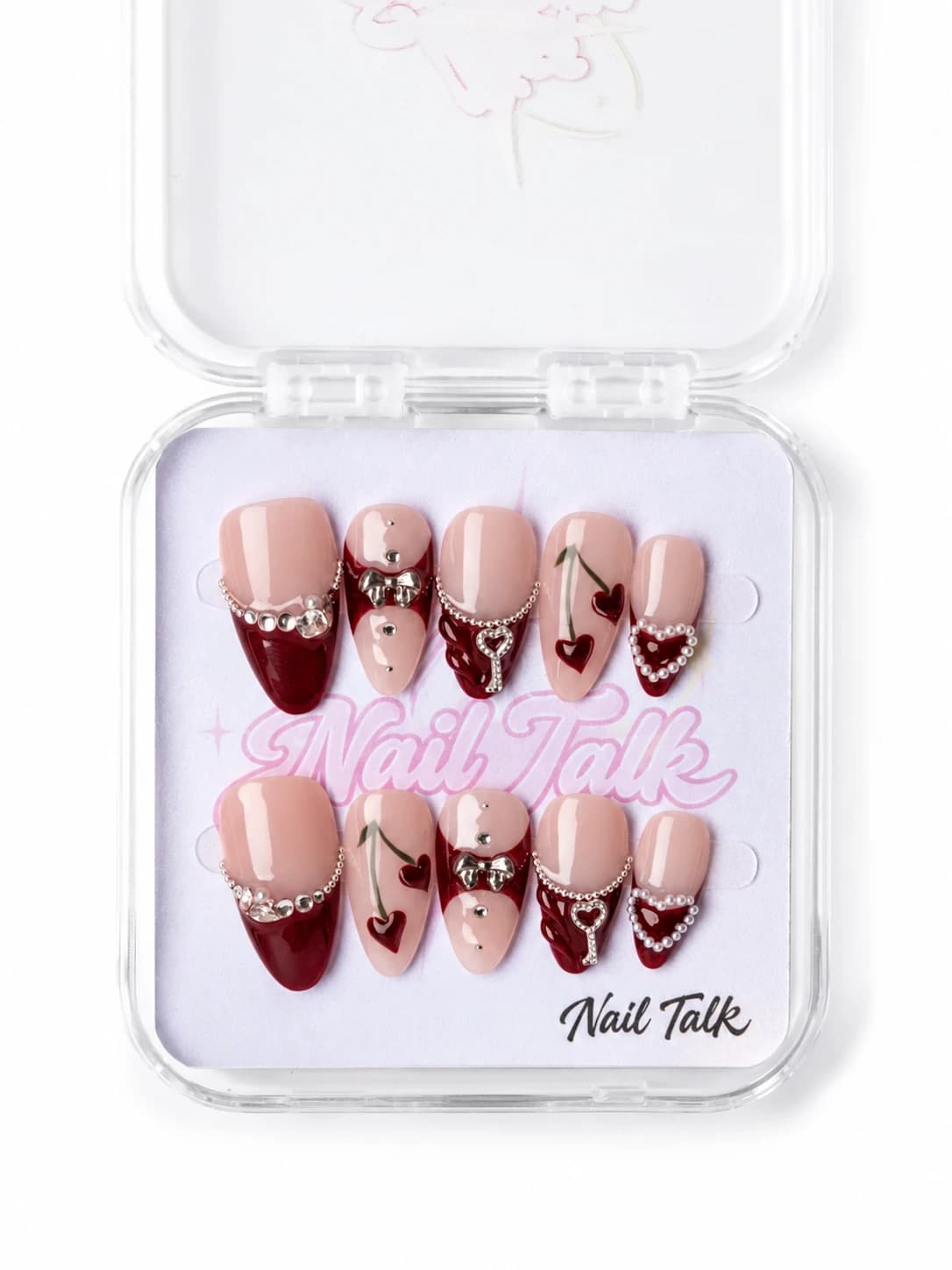 Burgundy French press-on nails with cherry hearts, silver bows and a heart key charm